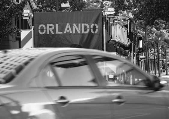 grayscale photo of a car on the road
