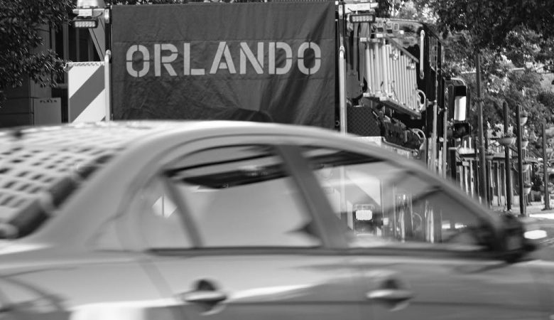 grayscale photo of a car on the road