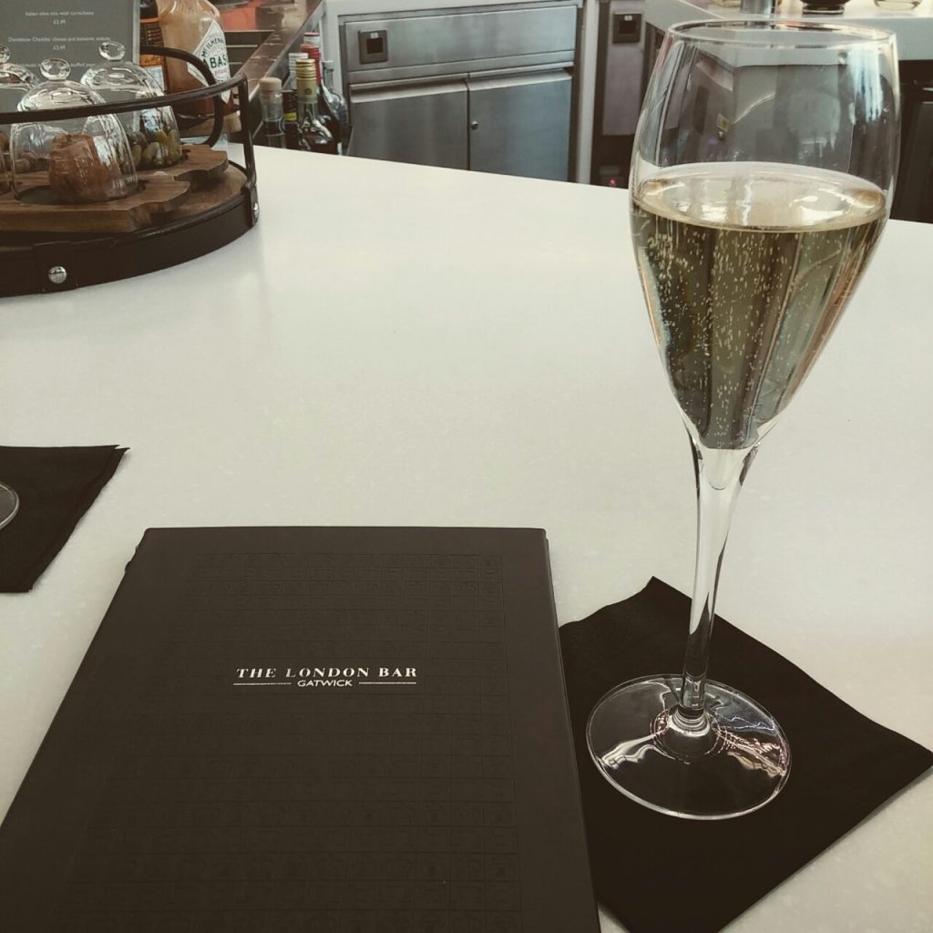 Champagne glass in the London Bar before boarding our Virgin Atlantic flight.