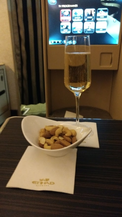 Champagne and nuts in Etihad Business Class