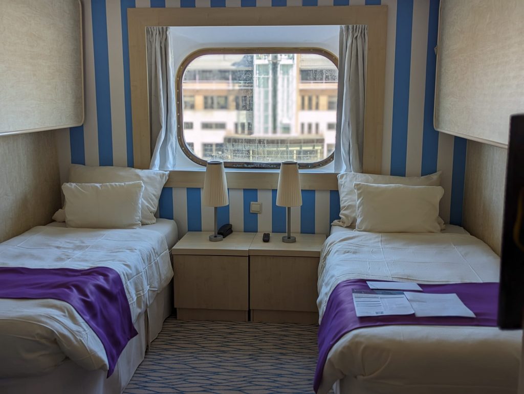 Outside cabin in twin configuration on Ambition cruise ship.